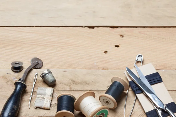 Embroidery and needlework tools on wood background — Stock Photo, Image