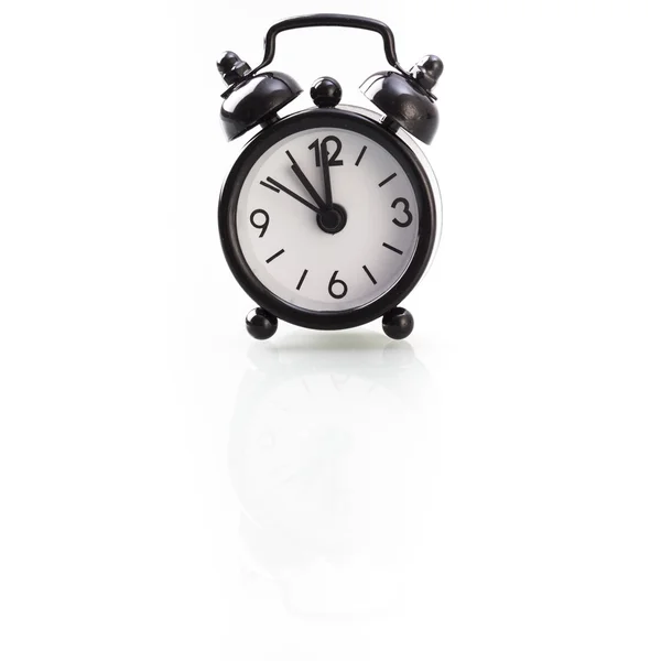 Reloj despertador negro mostrando once — Foto de Stock