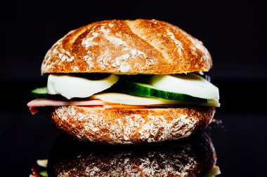 Breakfast sandwich on reflection background