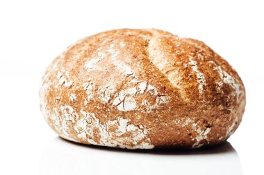 Closeup to wholegrain wheat bread roll, on white background