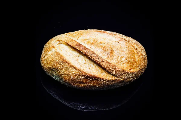 Top view potato bread roll, on black background — ストック写真