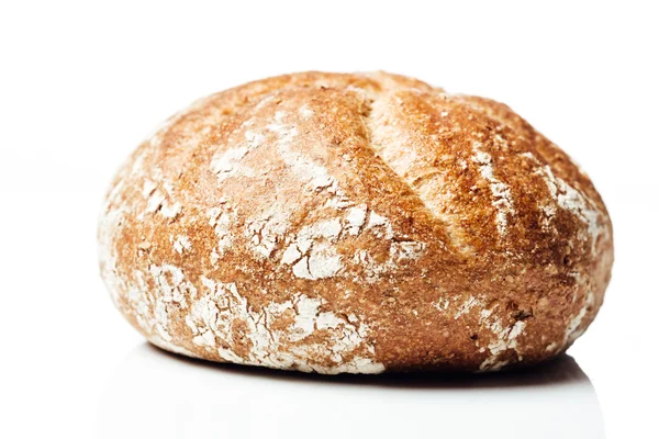 Closeup to wholegrain wheat bread roll, on white background — Φωτογραφία Αρχείου