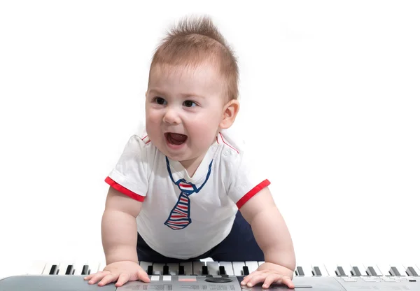 Little baby with electric piano — Stock Photo, Image