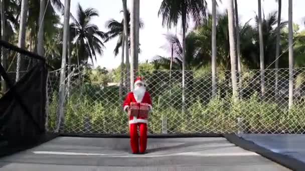 Santa Jumping Trampoline Bag Gifts Gift Box Boy Santa Clause — Stock Video