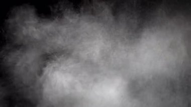 Siyah arkaplanı olan bir kum veya parçacık tipi