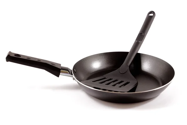Kitchen spatula and teflon pan — Stock Photo, Image