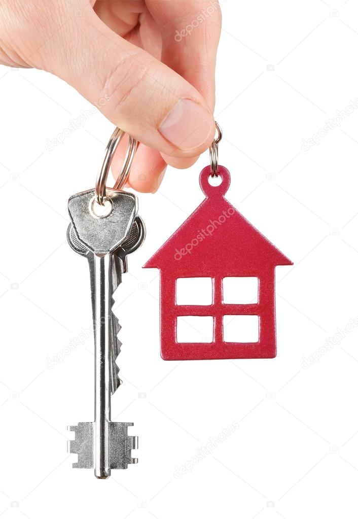 House keys in hand isolated on white background