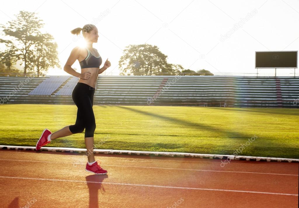 Athlete running in morning sunrise