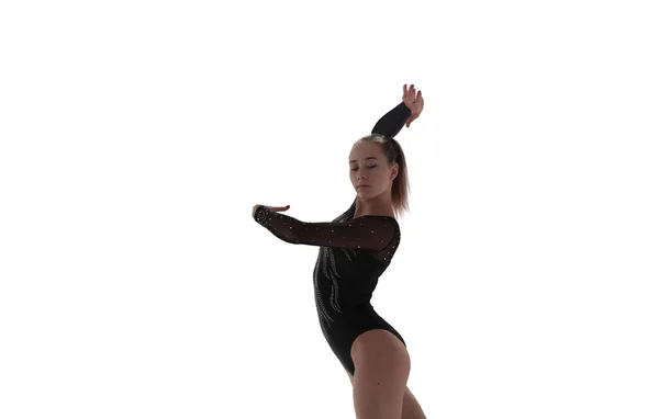 女体操运动员在职业舞台上做着复杂的动作 — 图库照片