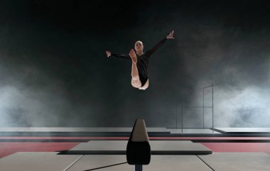 Profesyonel bir arenada kadın jimnastikçi karmaşık bir numara yapıyor.