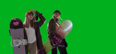 Snowboarding riders isolated on green screen.