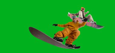 Snowboarding riders isolated on green screen.