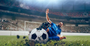 Futbolcular stadyumda futbol oynarlar..