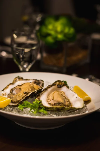 Two Raw Fresh Oysters Served Bed Ice Two Wedges Lemon Stock Picture