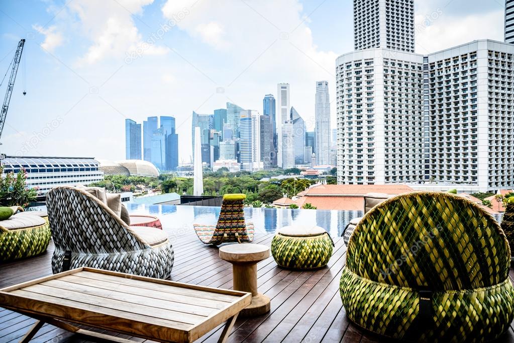 Rooftop swimming pool and view of Singapore city skyline