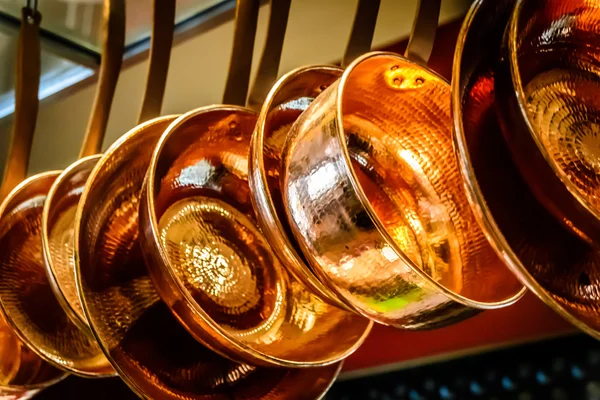 Hanging copper pots, pans, saucepans — Stock Photo, Image