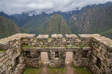 Doors to mountain view in Machu Picchu ruins clipart