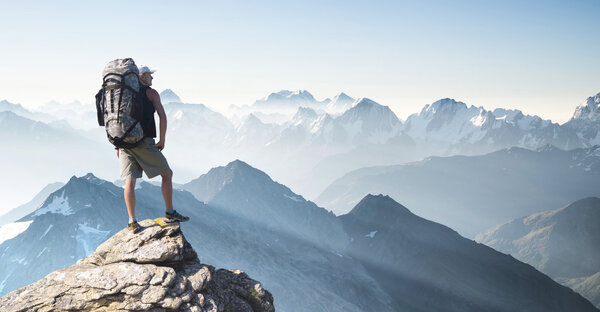 depositphotos_73356457-stock-photo-tourist-on-high-rocks.jpg