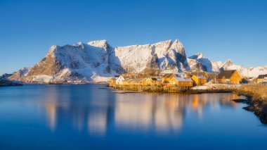 Panoramic view of the Lofoten Islands, Norway. Natural winter landscape. Picturesque view of traditional Norwegian fishermen's houses. Wide panoramic view. Postcards, backgrounds, wallpapers.