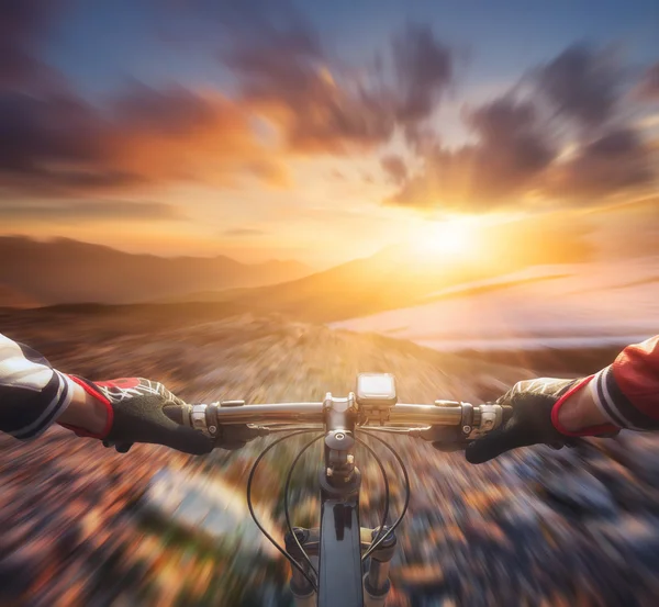 Fast ride on bike in mountain — Stock Photo, Image