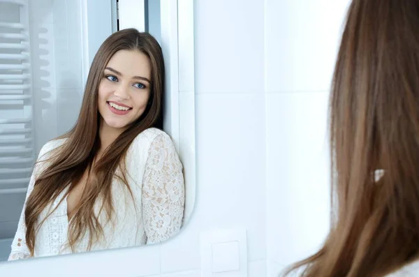 Young Woman Bathroom Polish Model Smiling Mirror Reflection — Zdjęcie stockowe