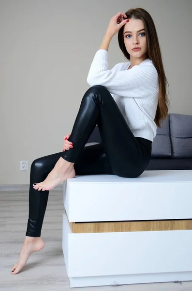 Pretty Young Woman Black Leggings White Sweater Staying Home Polish — Stock fotografie