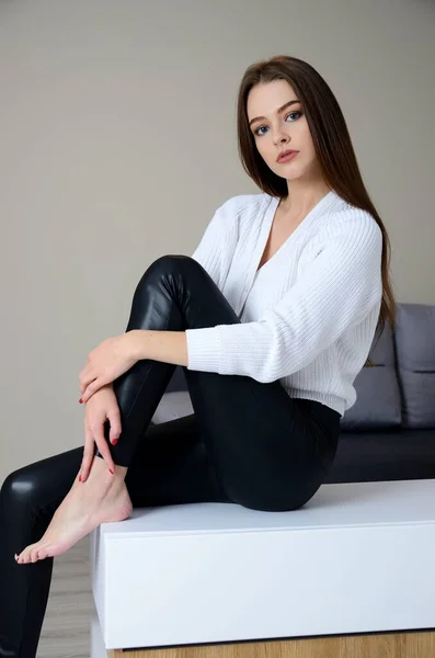 Pretty Young Woman Black Leggings White Sweater Staying Home Polish — Stock Photo, Image