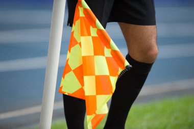 Assistant referee hold flag clipart