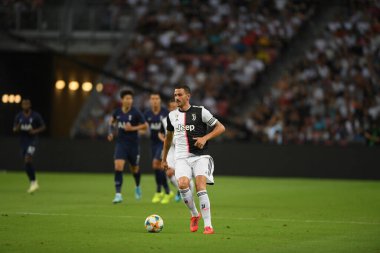 Kallang, Singapur - 21 Temmuz 2019: Juventus 'un oyuncusu, Juventus ve Spur arasında Singapur' daki ulusal stadyumda 2019 yılındaki eylemde.