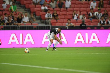 Kallang, Singapur - 21 Temmuz 2019: Juventus 'un oyuncusu, Juventus ve Spur arasında Singapur' daki ulusal stadyumda 2019 yılındaki eylemde.