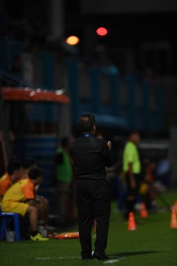 Bangkok-Thailand- 13 Jul 2019:Sasom popprasert head coach of Chonburi fc in action during thaileague match between port fc against Chonburi fc at pat stadium, Thailand