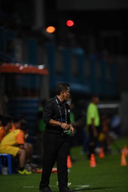 Bangkok-Thailand- 13 Jul 2019:Sasom popprasert head coach of Chonburi fc in action during thaileague match between port fc against Chonburi fc at pat stadium, Thailand