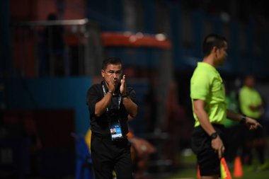 Bangkok-Thailand- 13 Jul 2019:Sasom popprasert head coach of Chonburi fc in action during thaileague match between port fc against Chonburi fc at pat stadium, Thailand