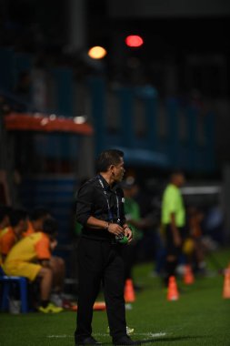 Bangkok-Thailand- 13 Jul 2019:Sasom popprasert head coach of Chonburi fc in action during thaileague match between port fc against Chonburi fc at pat stadium, Thailand