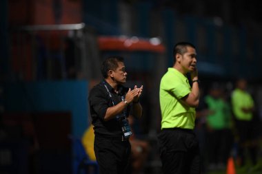 Bangkok-Thailand- 13 Jul 2019:Sasom popprasert head coach of Chonburi fc in action during thaileague match between port fc against Chonburi fc at pat stadium, Thailand