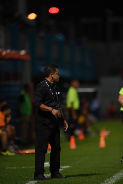 Bangkok-Thailand- 13 Jul 2019:Sasom popprasert head coach of Chonburi fc in action during thaileague match between port fc against Chonburi fc at pat stadium, Thailand