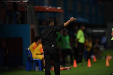 Bangkok-Thailand- 13 Jul 2019:Sasom popprasert head coach of Chonburi fc in action during thaileague match between port fc against Chonburi fc at pat stadium, Thailand