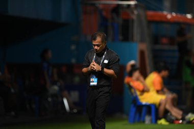 Bangkok-Thailand- 13 Jul 2019:Sasom popprasert head coach of Chonburi fc in action during thaileague match between port fc against Chonburi fc at pat stadium, Thailand