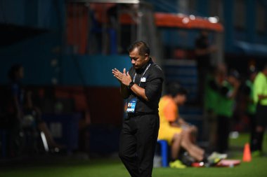 Bangkok-Thailand- 13 Jul 2019:Sasom popprasert head coach of Chonburi fc in action during thaileague match between port fc against Chonburi fc at pat stadium, Thailand