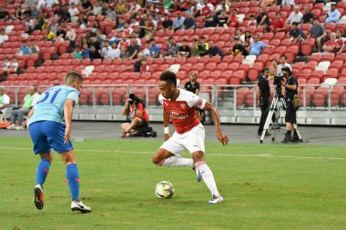 Kallang-Singapur-26 Haziran 2018: Pierre-Emerick Aubameyang # 14 numaralı cephanelik oyuncusu icc2018 'de atletico de Madrid' deki ulusal stadyumdaki cephaneliğe karşı savaşıyor.