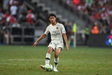 Kallang-Singapur-28 Temmuz 2018: Alexandre Fressange # 43 PSG oyuncusu, 2018 yılında, Singapur 'daki Paris Saint-Almanya Stadyumu' ndaki cephaneliğe karşı savaşıyor. 