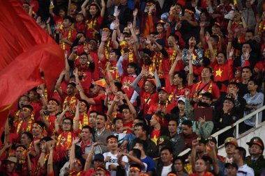 Hanoi-Vietnam-19 Nov 2019: Unidentified fan of Vietnam playing wave human during fifa world cup qatar 2022 against Vietnam at My dinh stadium,Vietnam