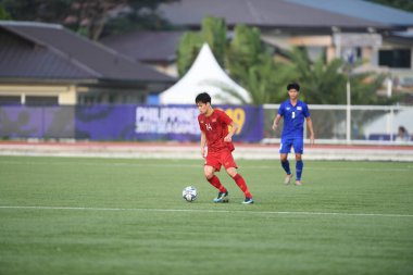 Laguna-Filipin-5 Aralık 2019: SEAGAMES 2019 sırasında Vietnam 'ın 14 numaralı oyuncusu Nguyen Hoang Duc Binan futbol stadyumunda Vietnam' a karşı oynuyordu.