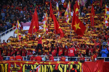 Hanoi-Vietnam-19 Nov 2019: Unidentified fan of Vietnam playing wave human during fifa world cup qatar 2022 against Vietnam at My dinh stadium,Vietnam