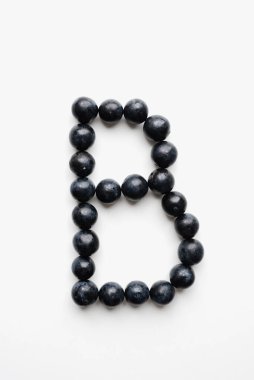 alphabet from fruits of thorns, thorns on white background 