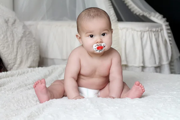 Baby with soother — Stock Photo, Image