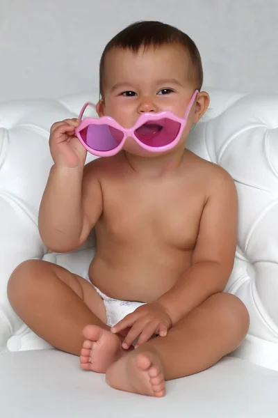 Baby at pink glasses — Stock Photo, Image