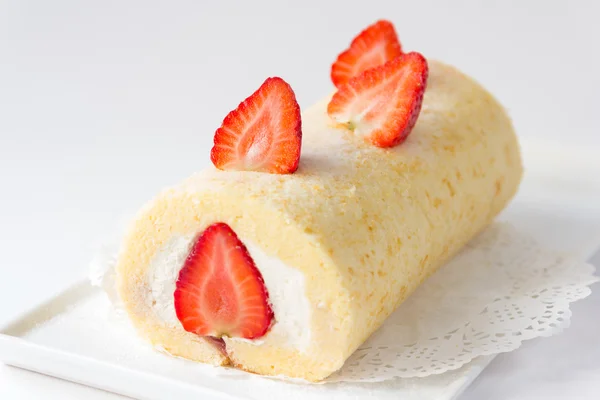 roll cake topping with strawberry