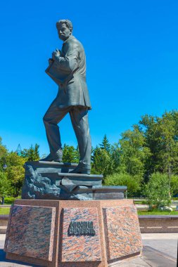 OMSK, RUSSIA - July 15, 2020: Monument to Russian artist Mikhail Vrubel close-up on the central street of Omsk, front view. Daytime cloudless weather.