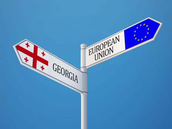 Europeiska unionen Georgien Sign flaggor koncept — Stockfoto